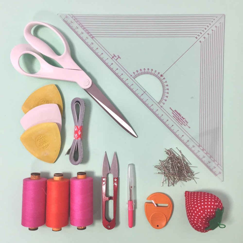 sewing essential supplies, scissors, set square, chalk, tape measure, threads, thread snipper, unpicking tool, pin cushion, pins, scissor sharpener